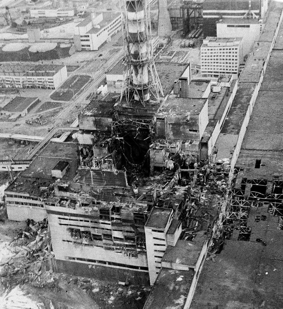 An aerial view of the Chernobyl nucler power plant, the site of the world's worst nuclear accident, is seen in April 1986, made two to three days after the explosion in Chernobyl, Ukraine. In front of the chimney is the destroyed 4th reactor. (AP Photo)